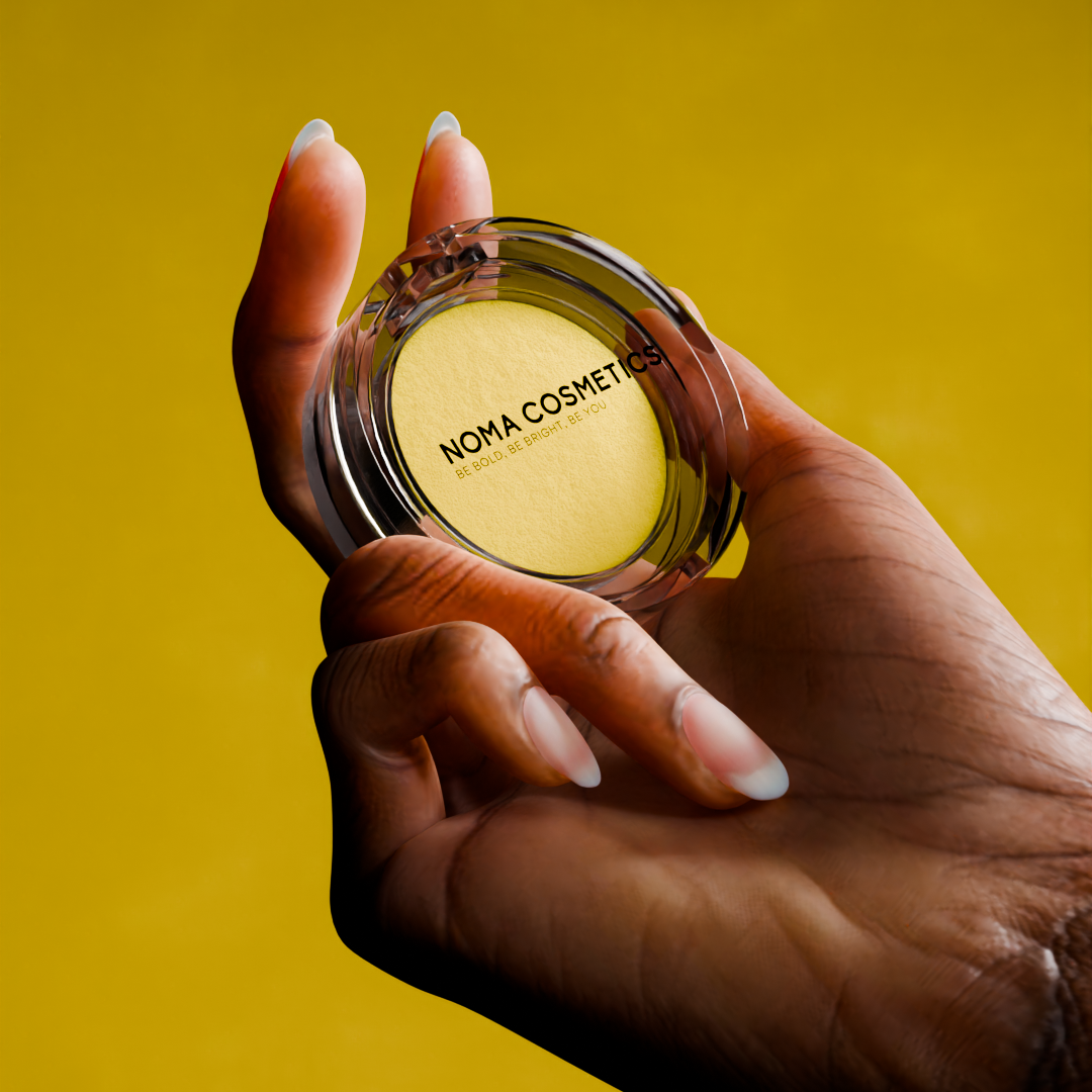 Bright Side Water Activated Liner | Vegan Eyeliner – Noma held in hand against a vibrant yellow background.